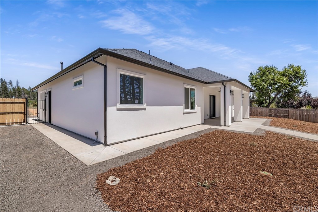 1830 Apple View Way Paradise, CA 95969 - Photo 55 of 75 a view of a white house with a yard and large tree