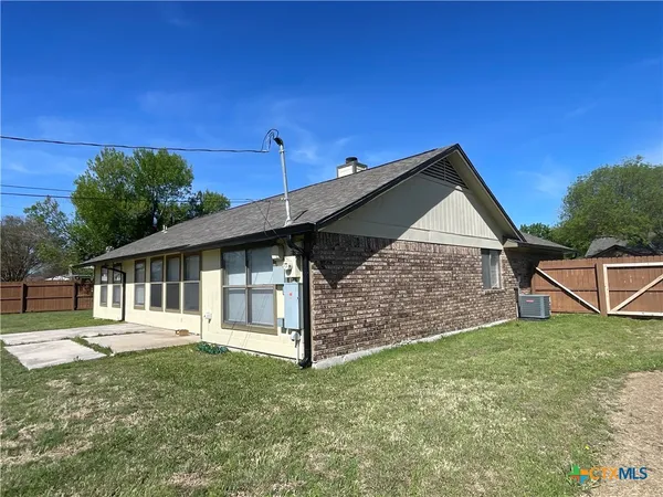 a view of a backyard with a garden