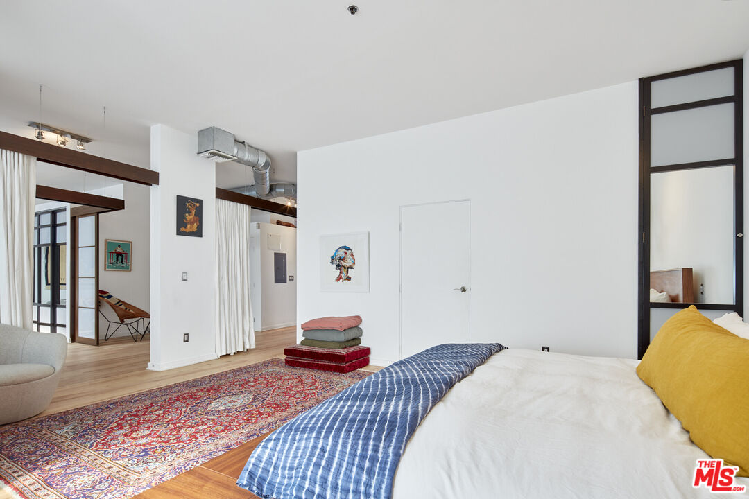 615 Hampton Drive, Unit B201 Venice, CA 90291 - Photo 12 of 39 a bedroom with a bed and a couch