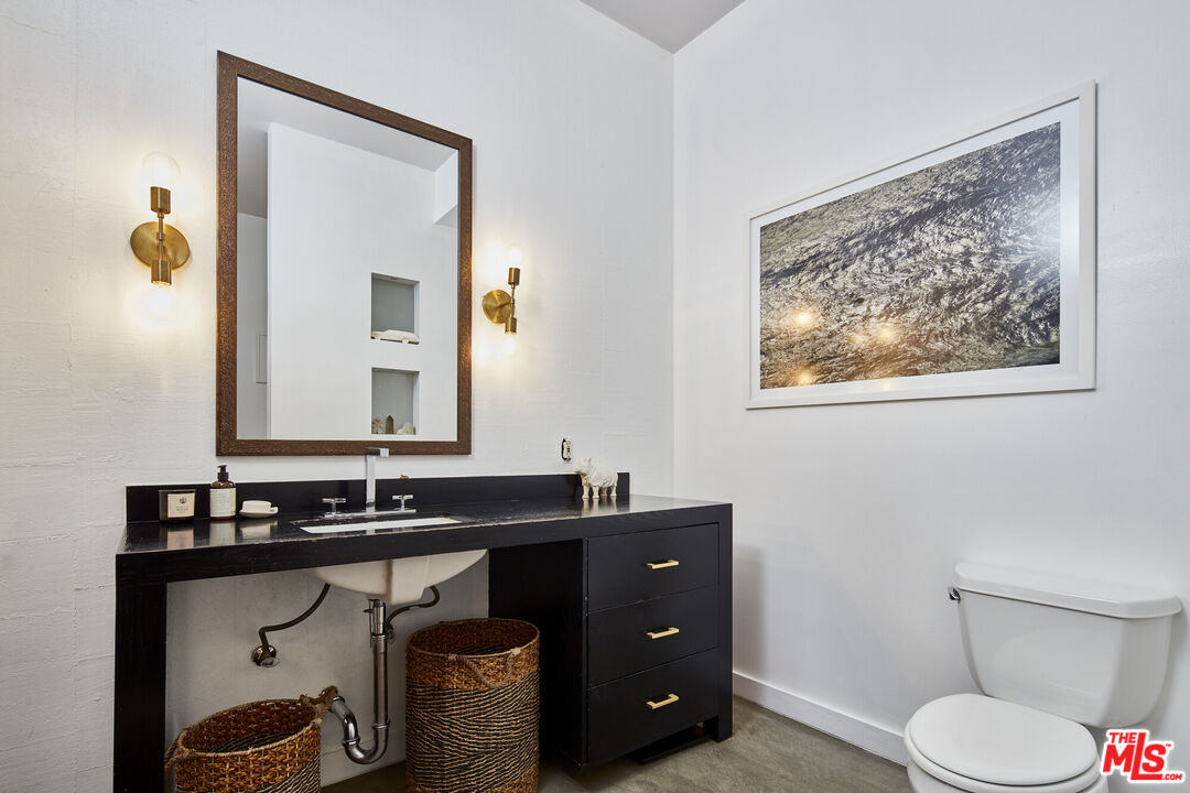 615 Hampton Drive, Unit B201 Venice, CA 90291 - Photo 27 of 39 a bathroom with a sink vanity and a mirror