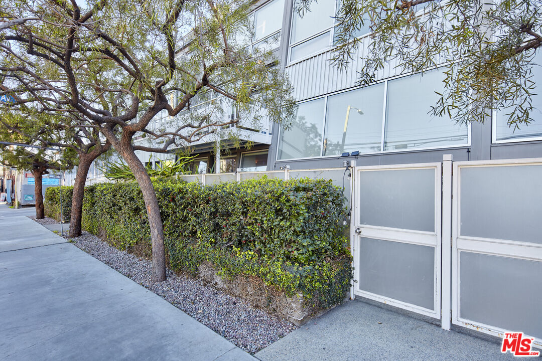 615 Hampton Drive, Unit B201 Venice, CA 90291 - Photo 36 of 39 a house with trees in front of it