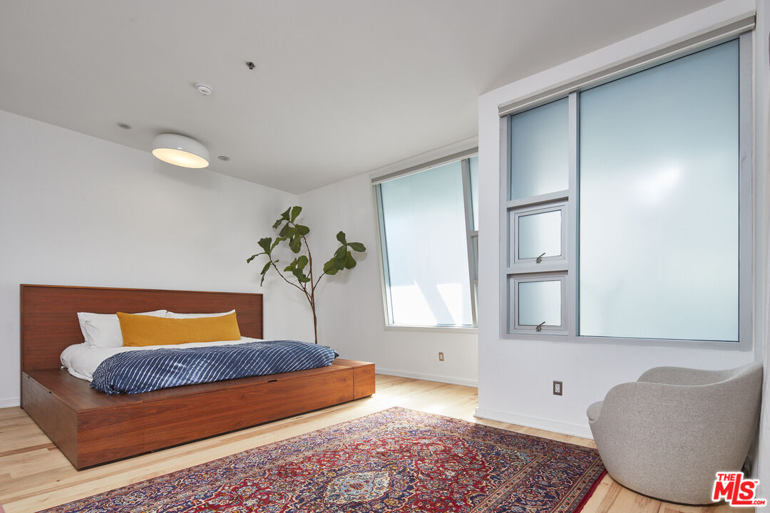 615 Hampton Drive, Unit B201 Venice, CA 90291 - Photo 10 of 39 a bedroom with a bed and window