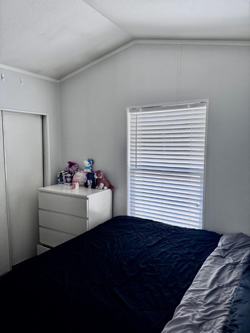 4320 Monterey Road, Unit 16 San Jose, CA 95111 - Photo 9 of 13 a view of bedroom with furniture and a window