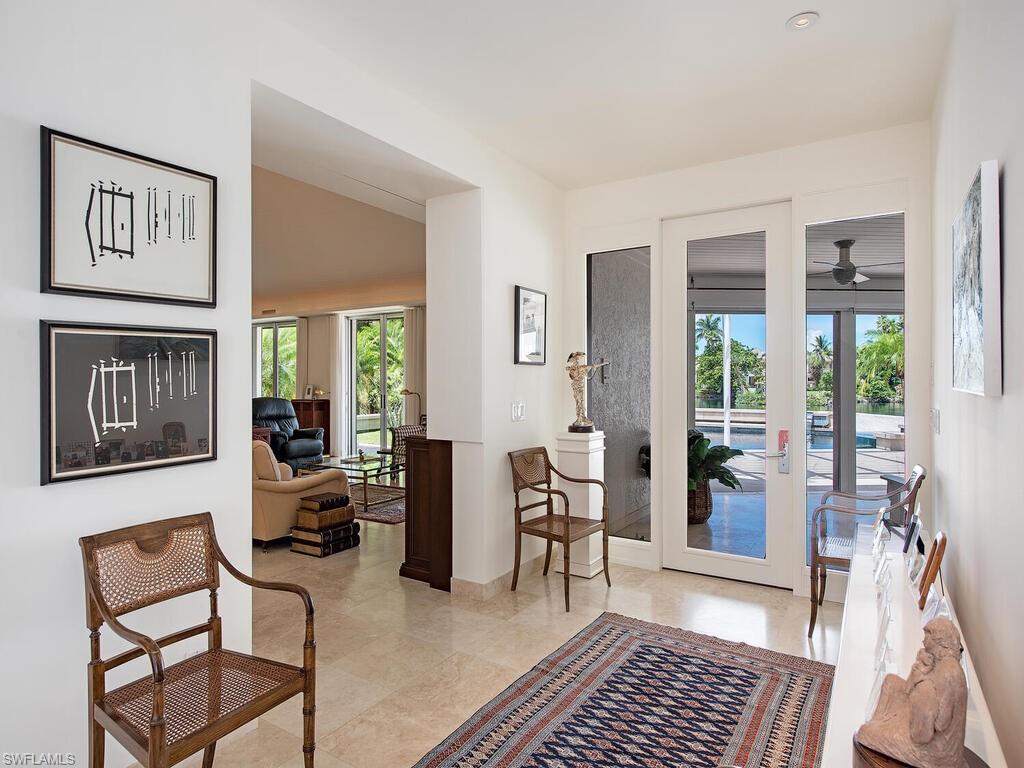 2680 Lantern Lane Naples, FL 34102 - Photo 5 of 24 a living room with furniture and a window