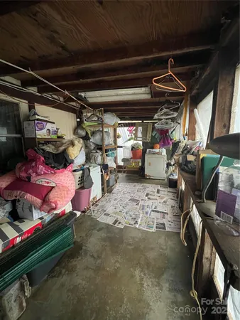 a bedroom with a bed and a tv