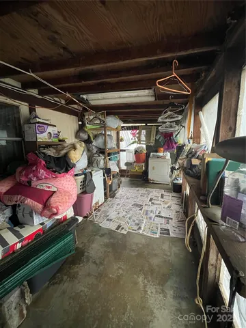 a bedroom with a bed and a tv
