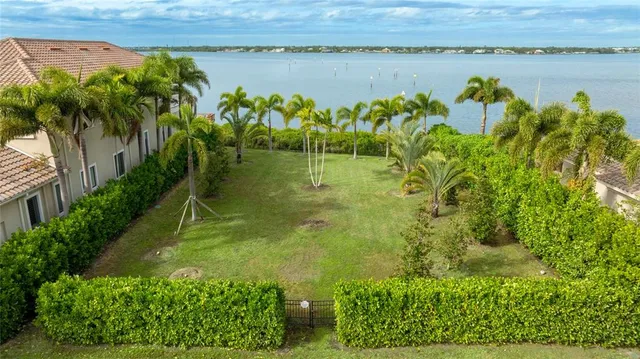 a view of a lake with a big yard