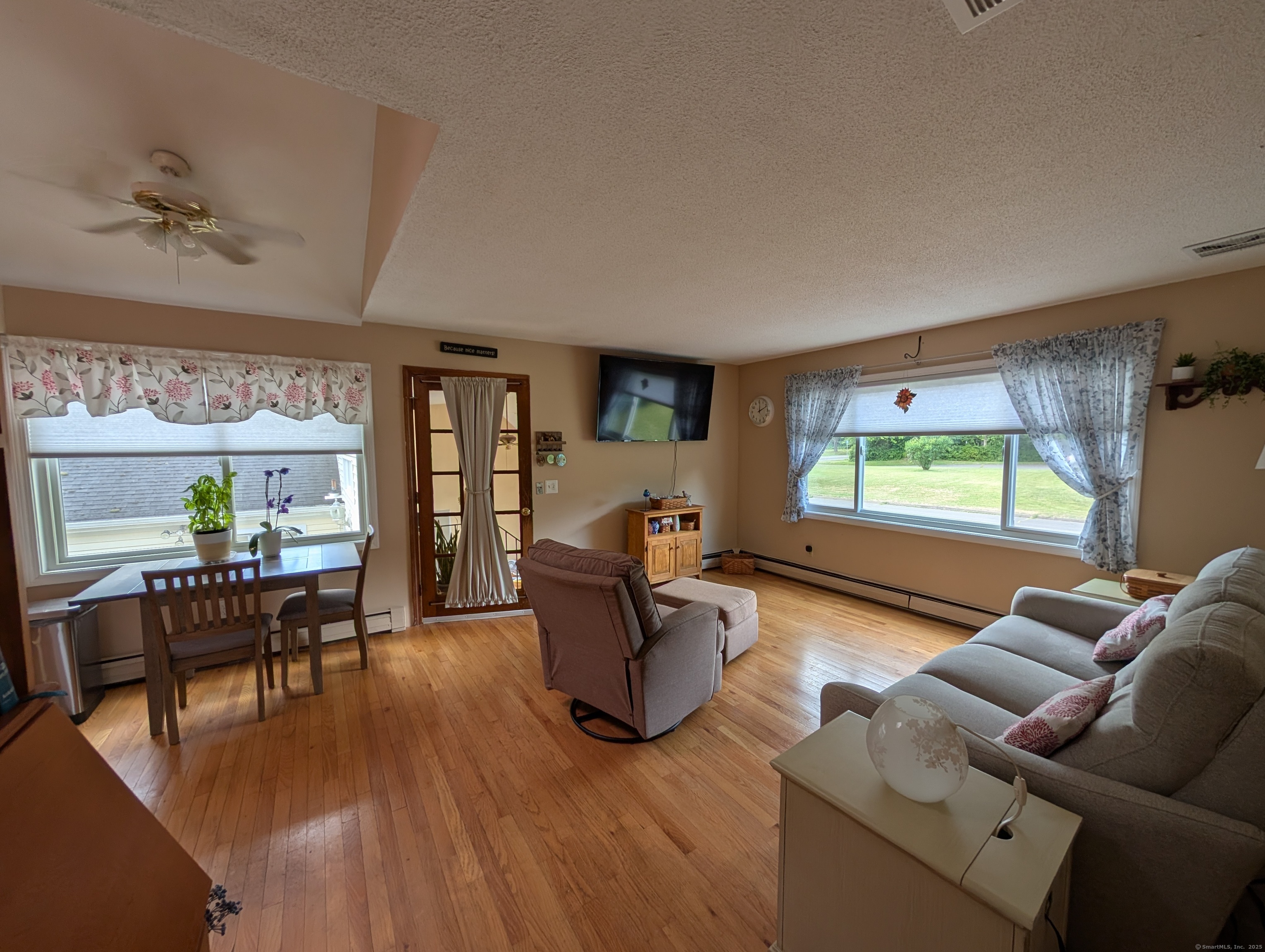 2805 Boston Post Road Guilford, CT 06437 - Photo 20 of 35 a living room with furniture and a wooden floor