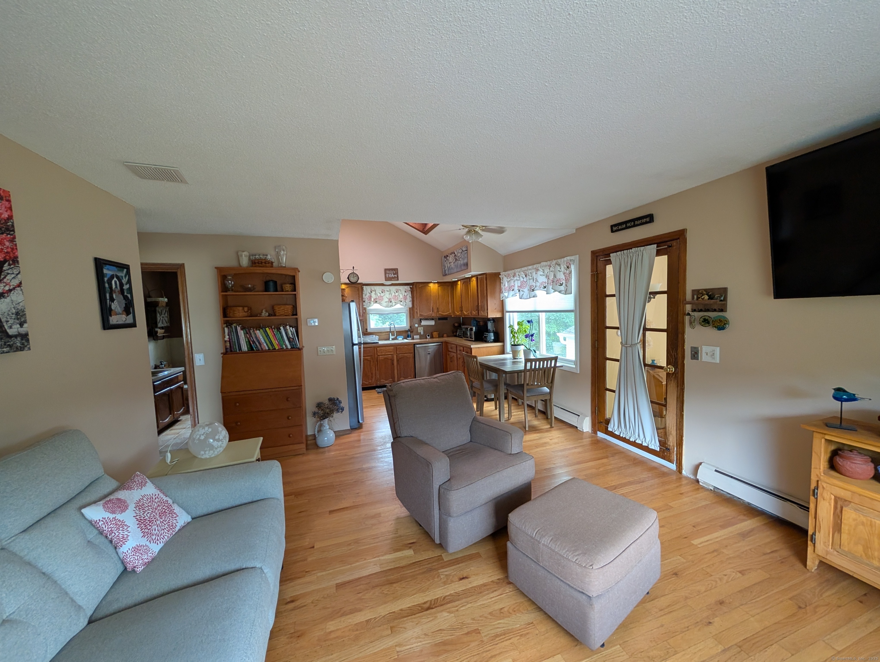 2805 Boston Post Road Guilford, CT 06437 - Photo 21 of 35 a living room with furniture and a flat screen tv