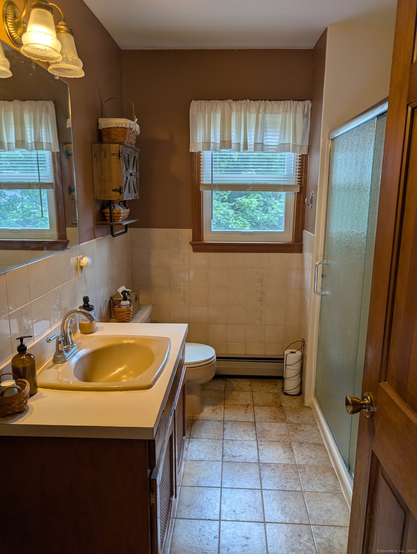 2805 Boston Post Road Guilford, CT 06437 - Photo 26 of 35 a bathroom with a sink and a mirror