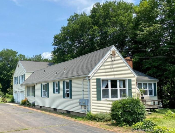 2805 Boston Post Road Guilford, CT 06437 - Photo 3 of 35 a front view of a house with a garden