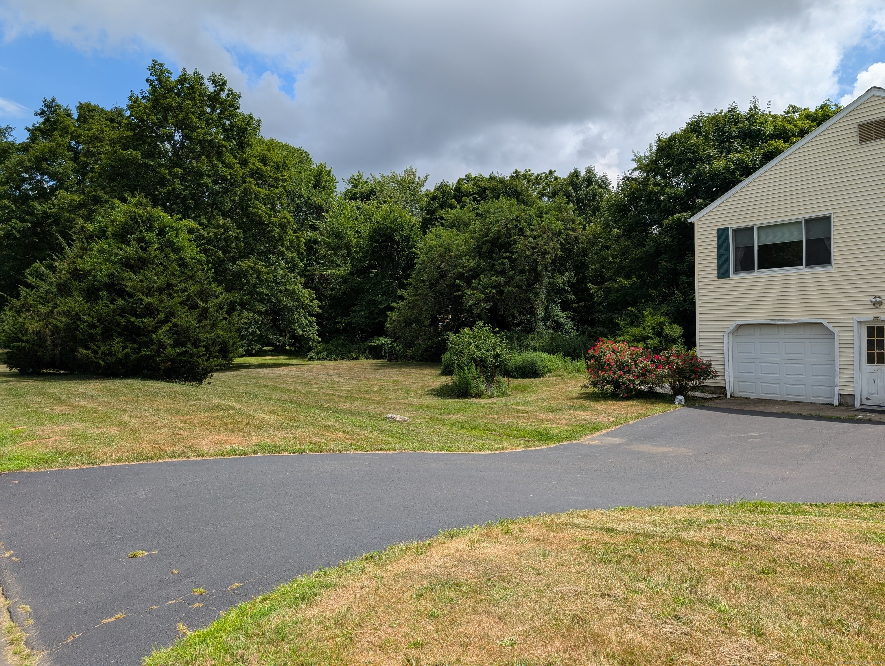 2805 Boston Post Road Guilford, CT 06437 - Photo 4 of 35 a view of a yard with basketball court