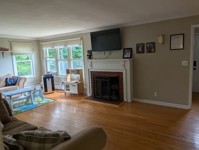 a living room with furniture and a fireplace
