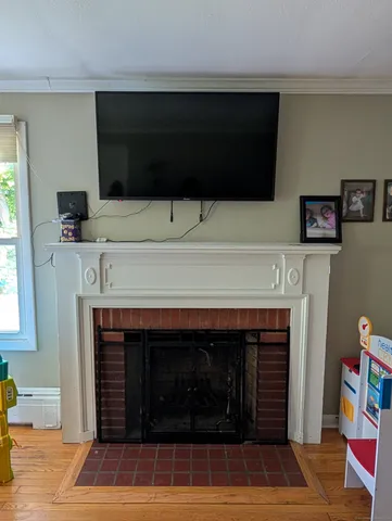 a fireplace with a flat screen tv