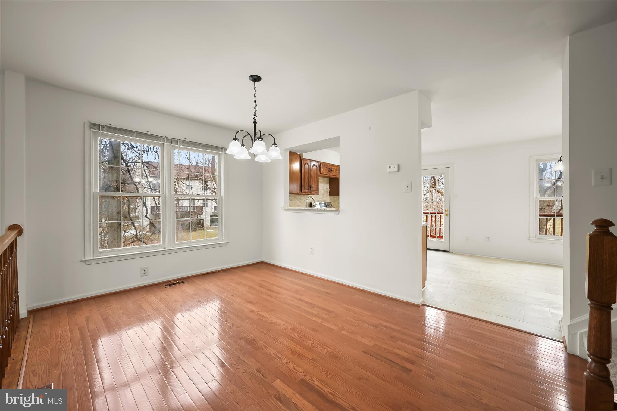 4750 Rams Horn Row Ellicott City, MD 21042 - Photo 14 of 54 a view of an empty room with window and wooden floor