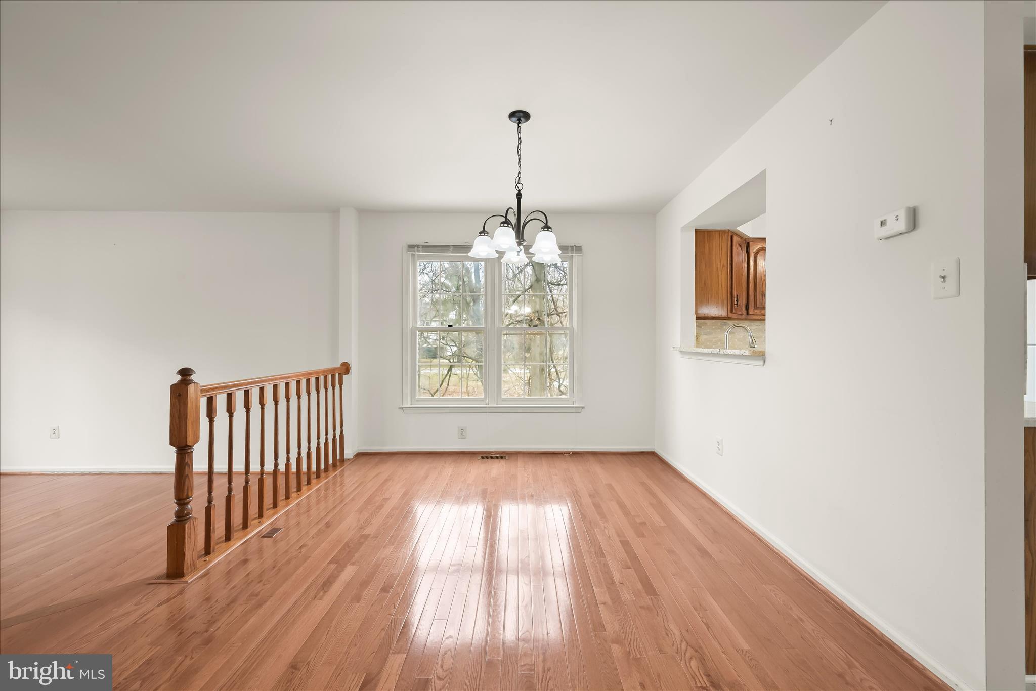 4750 Rams Horn Row Ellicott City, MD 21042 - Photo 15 of 54 a view of empty room with wooden floor and fan