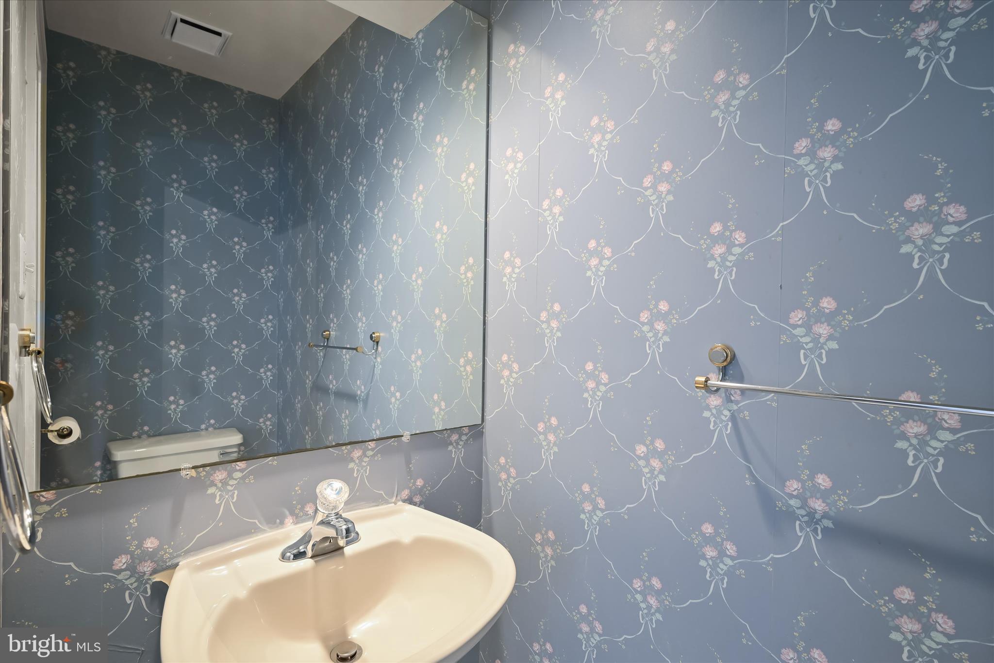 4750 Rams Horn Row Ellicott City, MD 21042 - Photo 25 of 54 a bathroom with a sink shower and a mirror