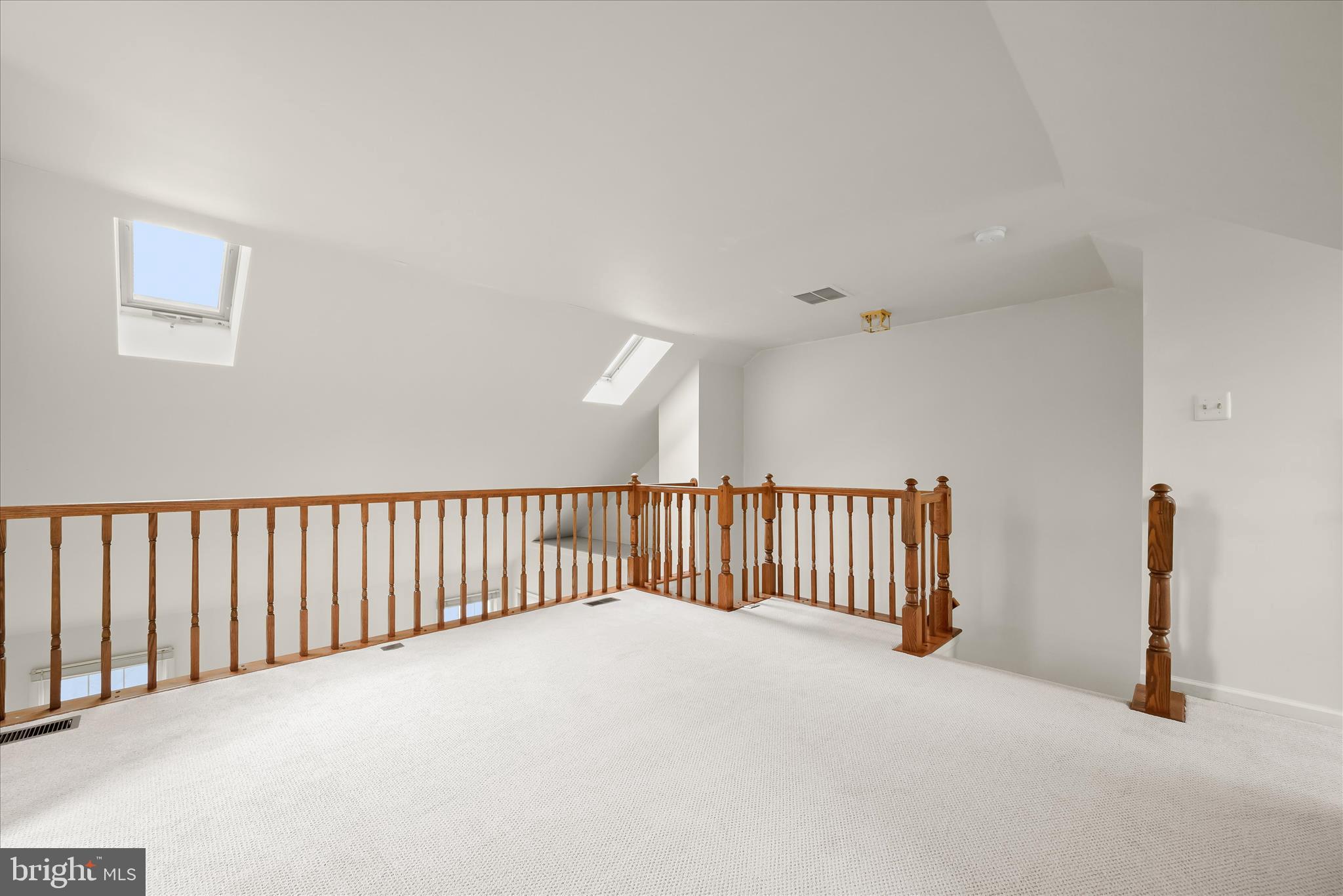 4750 Rams Horn Row Ellicott City, MD 21042 - Photo 31 of 54 a view of a room with wooden floor and a ceiling fan