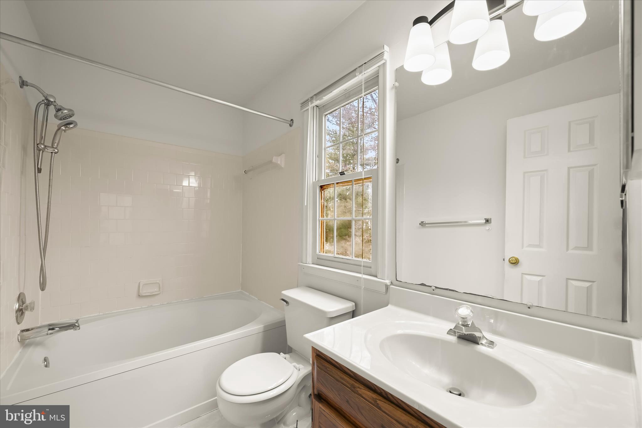 4750 Rams Horn Row Ellicott City, MD 21042 - Photo 33 of 54 a bathroom with a sink a toilet and shower