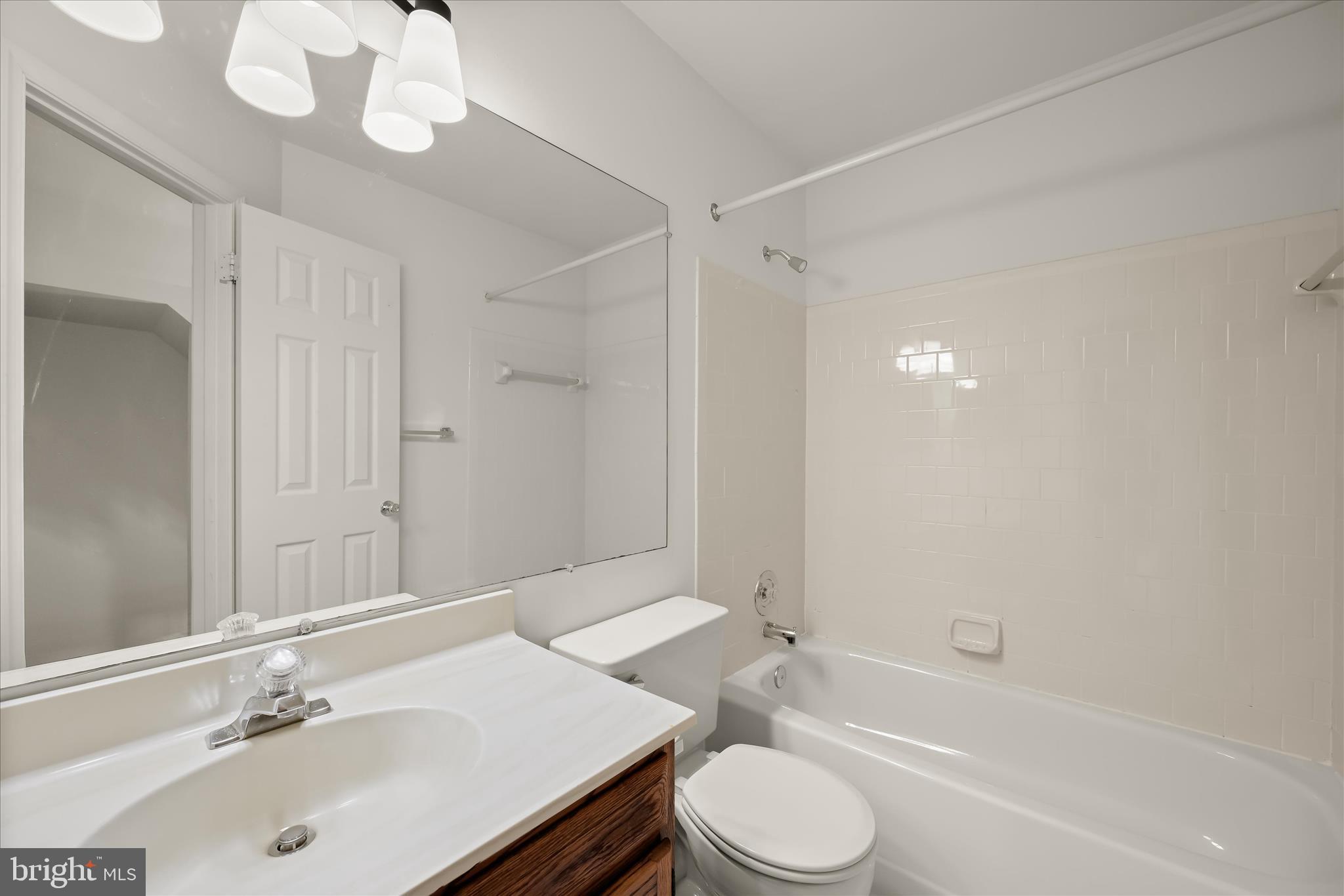 4750 Rams Horn Row Ellicott City, MD 21042 - Photo 38 of 54 a bathroom with a sink a toilet and a bathtub