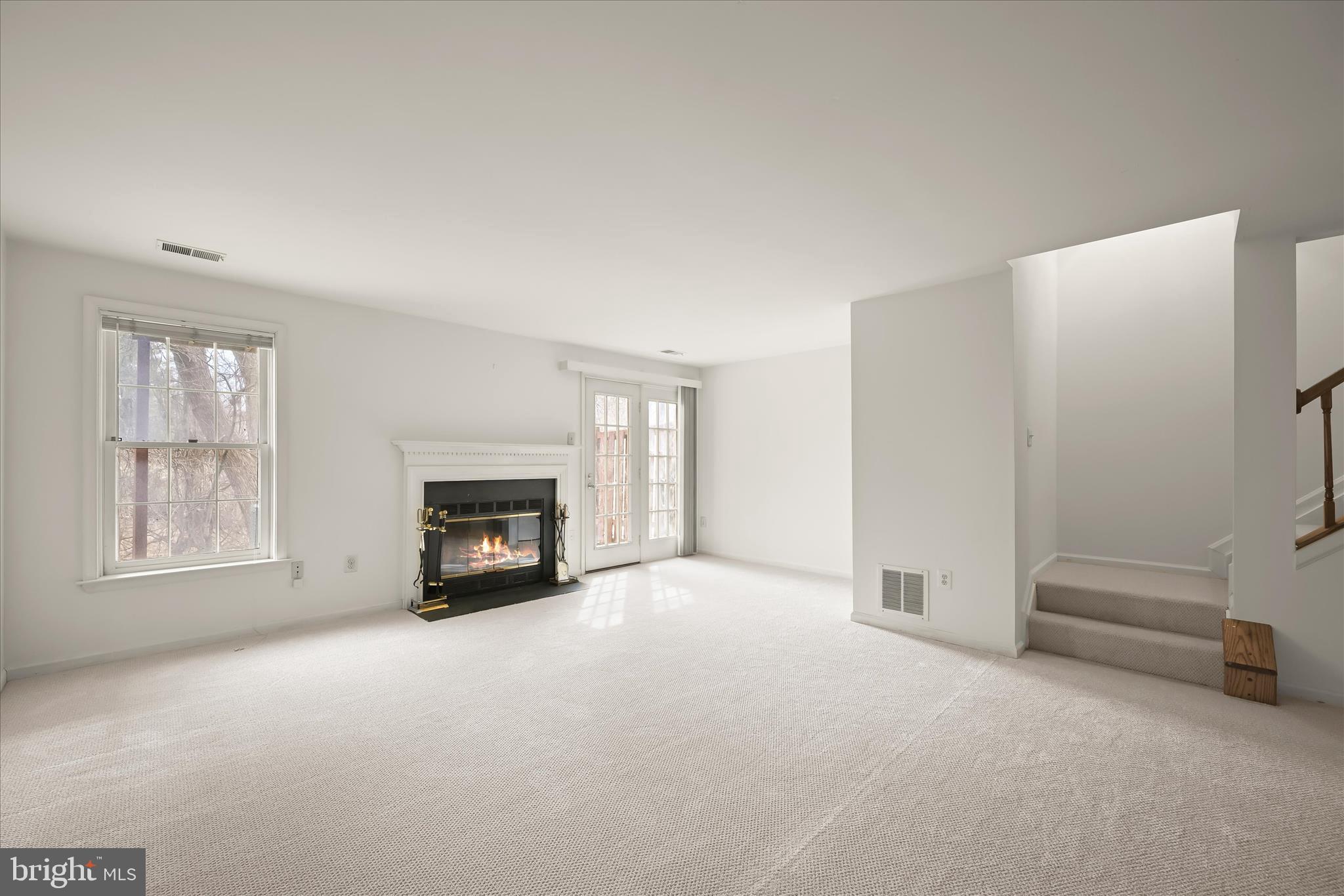 4750 Rams Horn Row Ellicott City, MD 21042 - Photo 40 of 54 a view of an empty room with a window and fireplace
