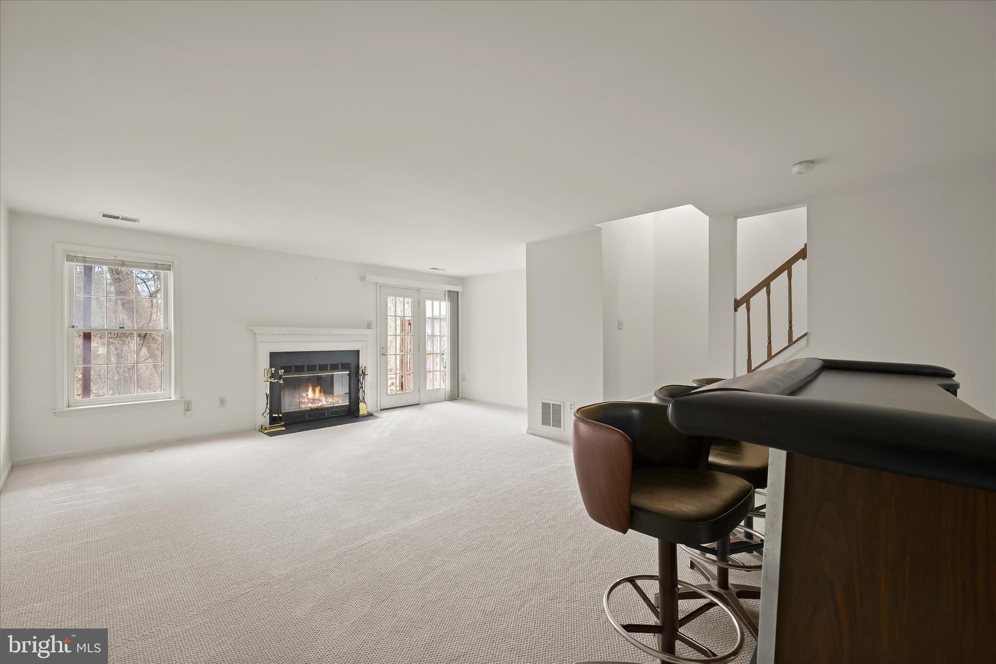 4750 Rams Horn Row Ellicott City, MD 21042 - Photo 41 of 54 a living room with furniture and a fireplace