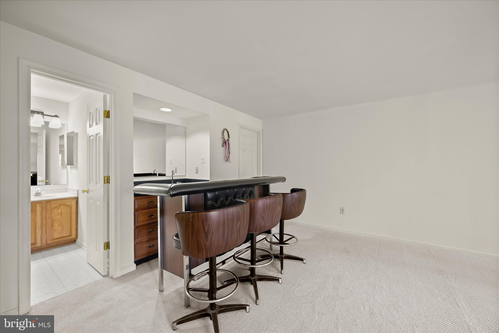4750 Rams Horn Row Ellicott City, MD 21042 - Photo 44 of 54 a view of a chair and table in a room