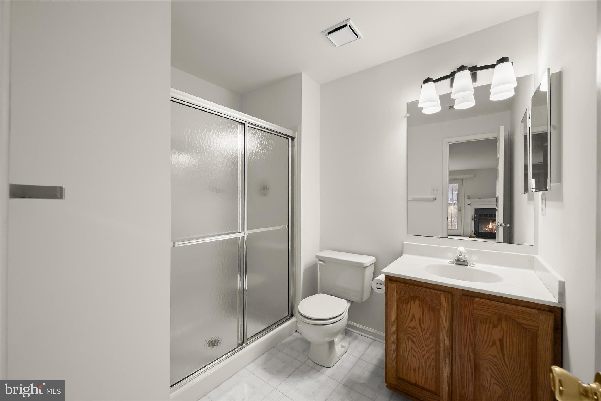 4750 Rams Horn Row Ellicott City, MD 21042 - Photo 46 of 54 a bathroom with a sink a toilet and shower