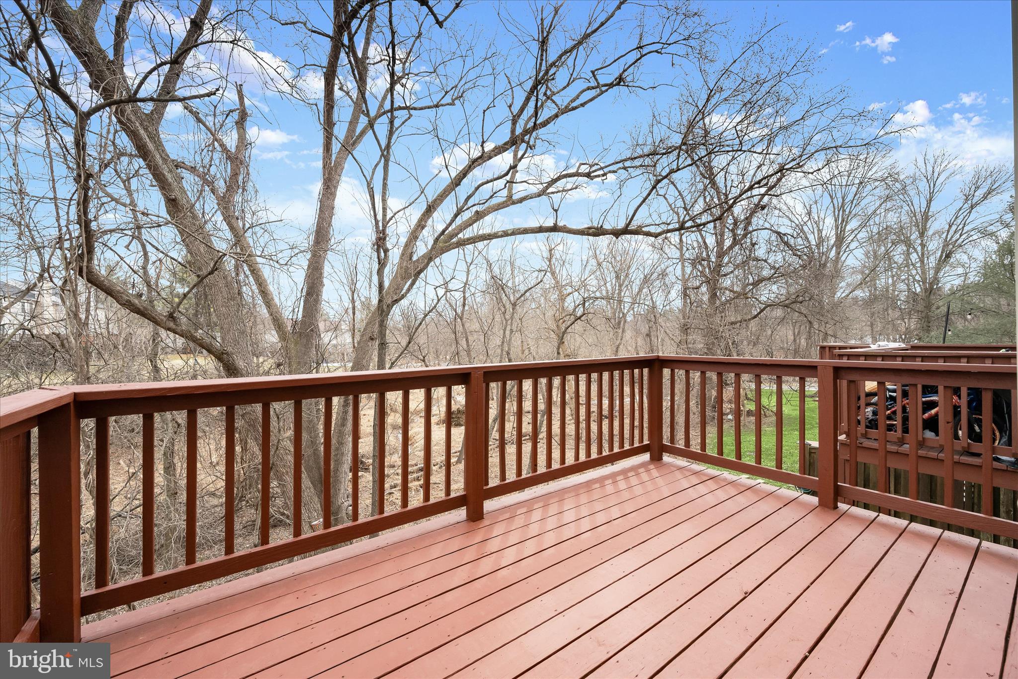 4750 Rams Horn Row Ellicott City, MD 21042 - Photo 47 of 54 a balcony with wooden floor and trees