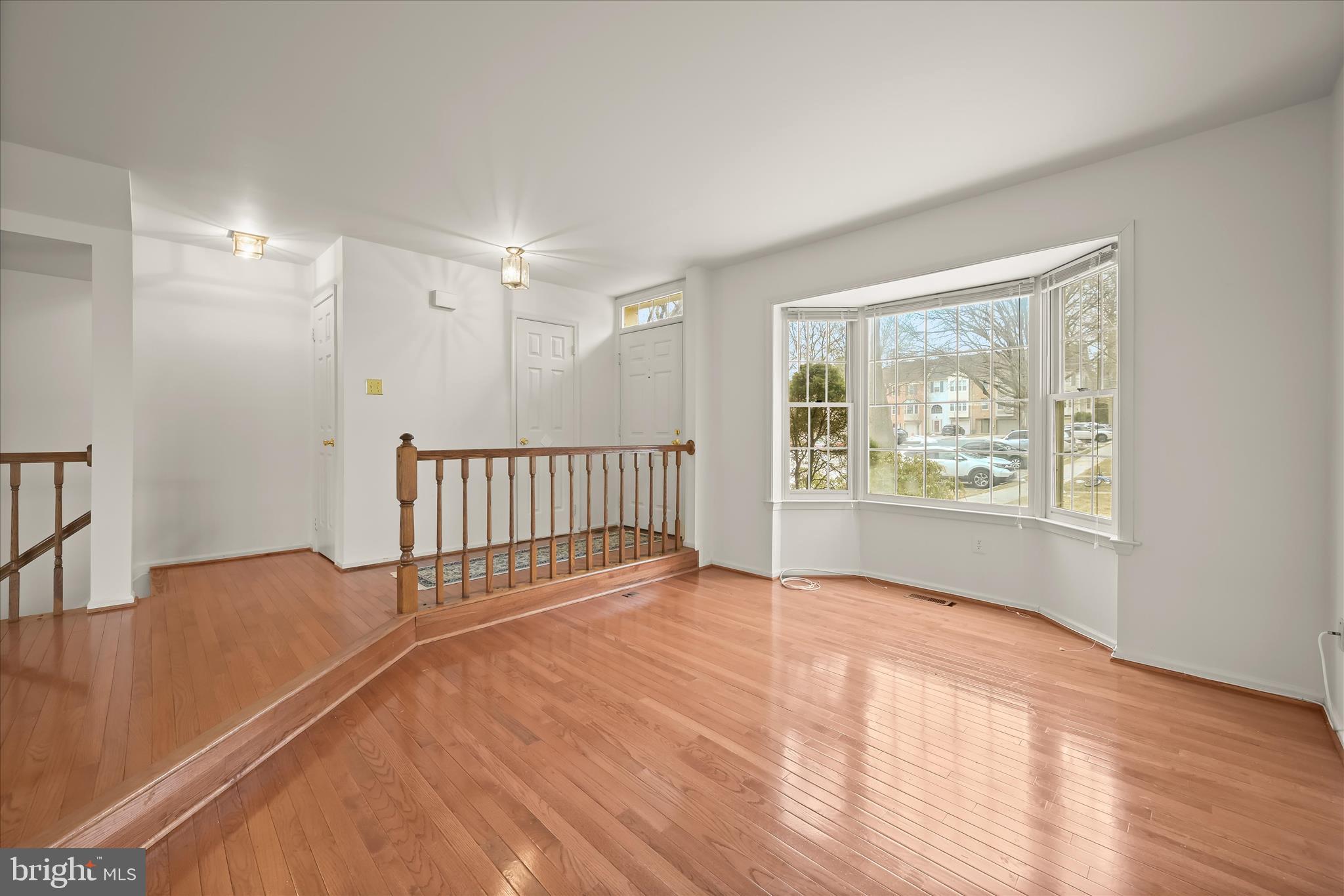 4750 Rams Horn Row Ellicott City, MD 21042 - Photo 10 of 54 a view of livingroom with hardwood floor and window