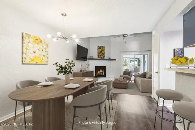 a spacious bedroom with a bed and a chandelier