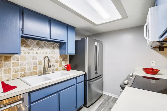 an empty room with windows and entrance