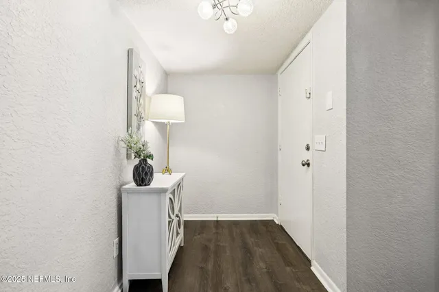 a bathroom with a tub shower vanity and a sink