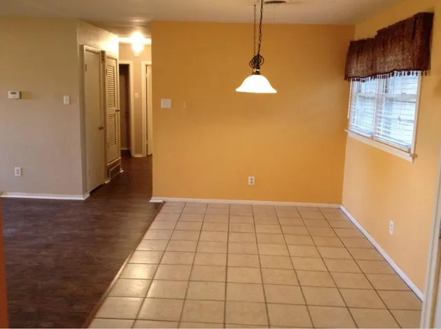 a view of an empty room and window