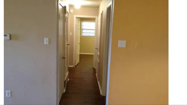 a view of a bathroom from a hallway