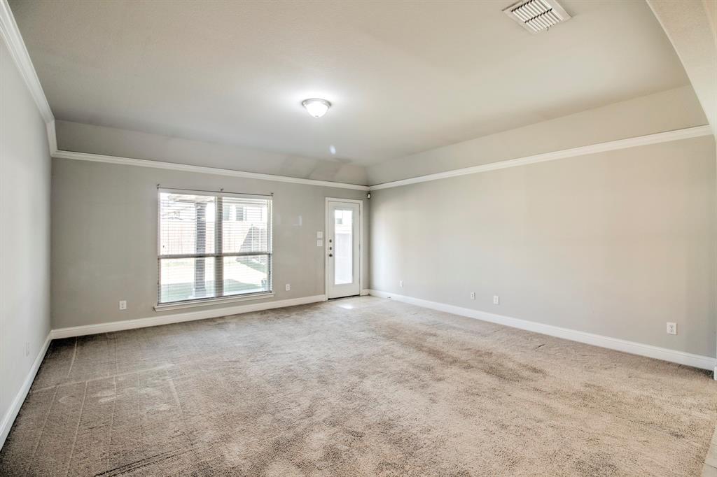 1925 Alton Way Aubrey, TX 76227 - Photo 13 of 32 an empty room with windows
