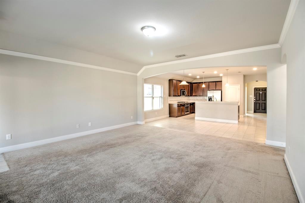 1925 Alton Way Aubrey, TX 76227 - Photo 15 of 32 an empty room with a cabinet and mirrors