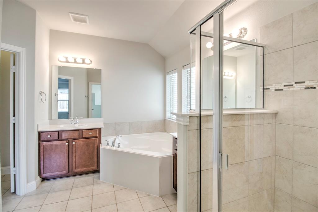 1925 Alton Way Aubrey, TX 76227 - Photo 21 of 32 a bathroom with a tub sink and mirror