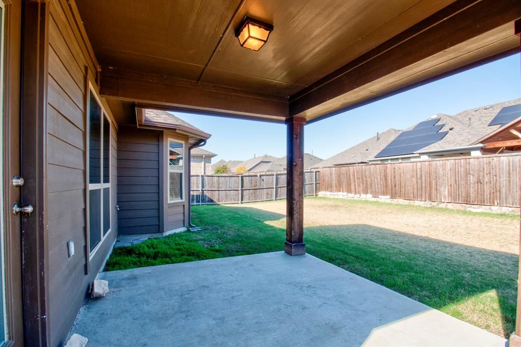 1925 Alton Way Aubrey, TX 76227 - Photo 28 of 32 a view of a backyard with wooden fence