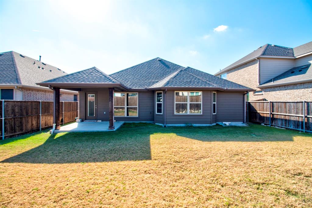 1925 Alton Way Aubrey, TX 76227 - Photo 30 of 32 a front view of a house with garden
