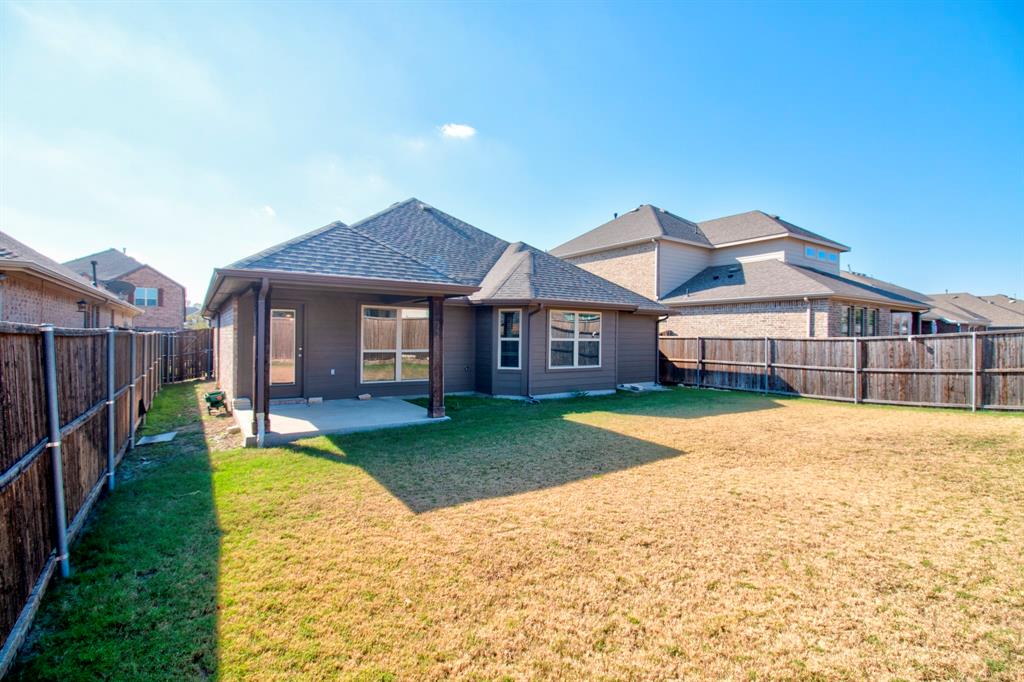 1925 Alton Way Aubrey, TX 76227 - Photo 31 of 32 a front view of a house with yard porch and outdoor seating
