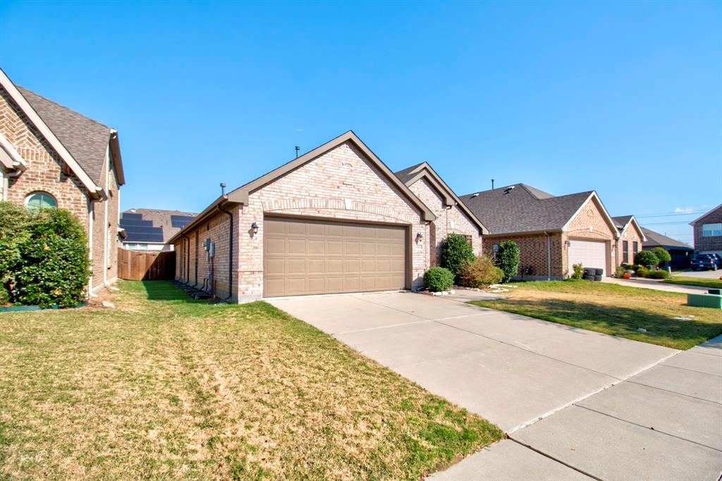 1925 Alton Way Aubrey, TX 76227 - Photo 4 of 32 a view of a house with a yard and garage