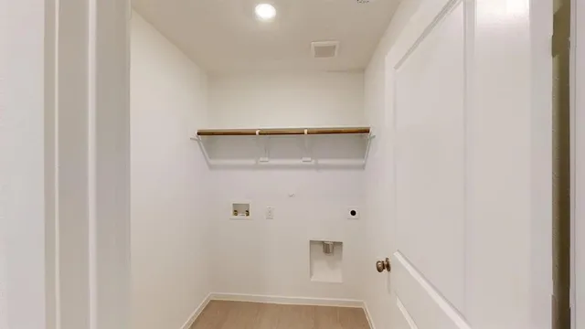 a view of a house with wooden fence