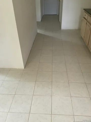 a view of empty room with windows