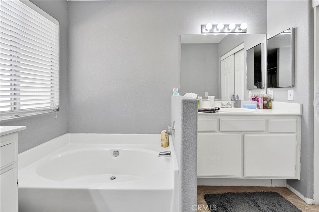 20403 Ochoa Road Apple Valley, CA 92307 - Photo 32 of 48 a bathroom with a sink and a mirror