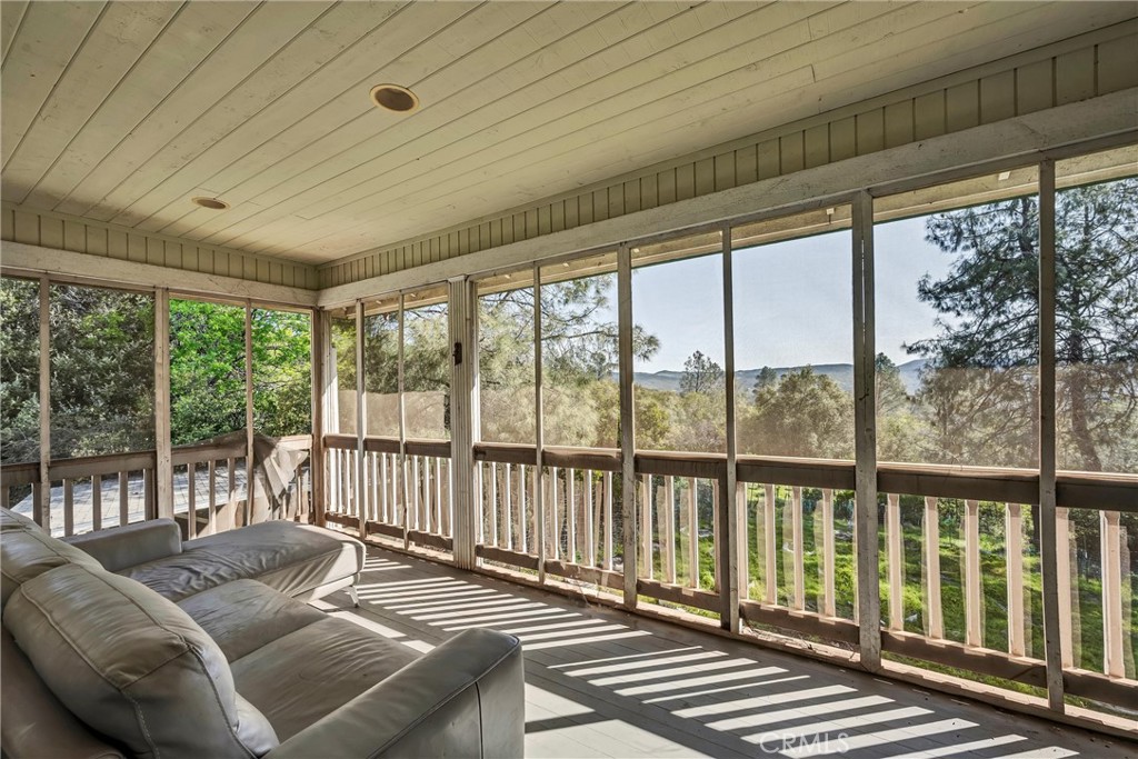 13988 Noble Ranch Road Lower Lake, CA 95457 - Photo 15 of 36 a living room with furniture and a floor to ceiling window