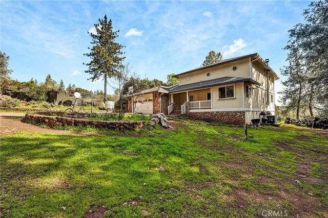 a front view of a house with a yard table and chairs