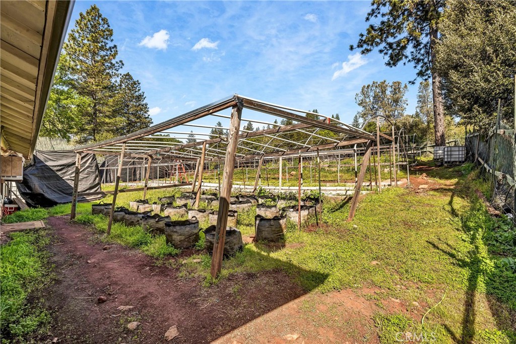 13988 Noble Ranch Road Lower Lake, CA 95457 - Photo 22 of 36 a view of a house with a backyard