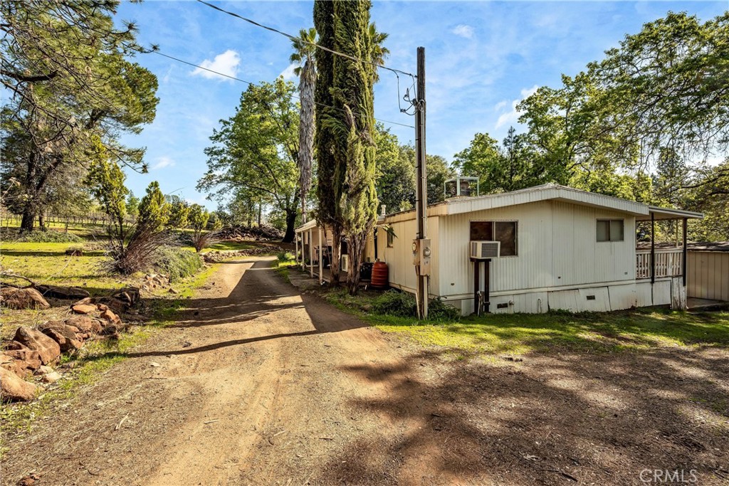 13988 Noble Ranch Road Lower Lake, CA 95457 - Photo 28 of 36 a view of a house with backyard and trees