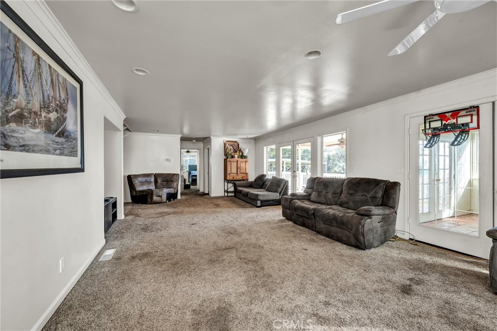 13988 Noble Ranch Road Lower Lake, CA 95457 - Photo 3 of 36 a living room with furniture and a large window